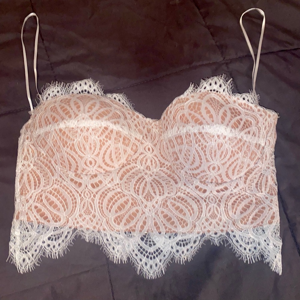 Super cute top! White lace with nude lining!